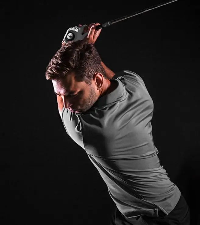 Man swinging a golf club